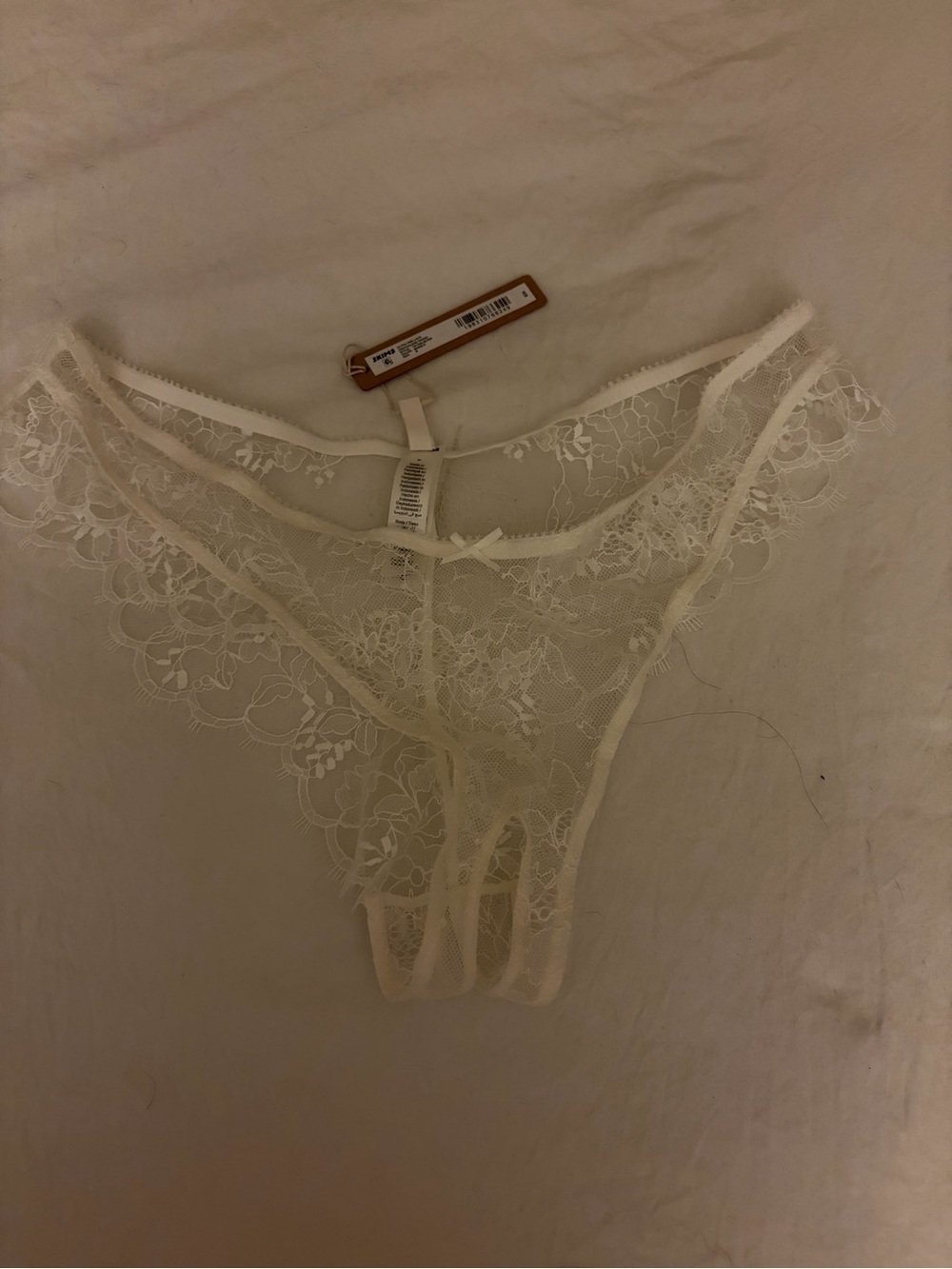 Skims Ultra fine lace crotchless thong in marble